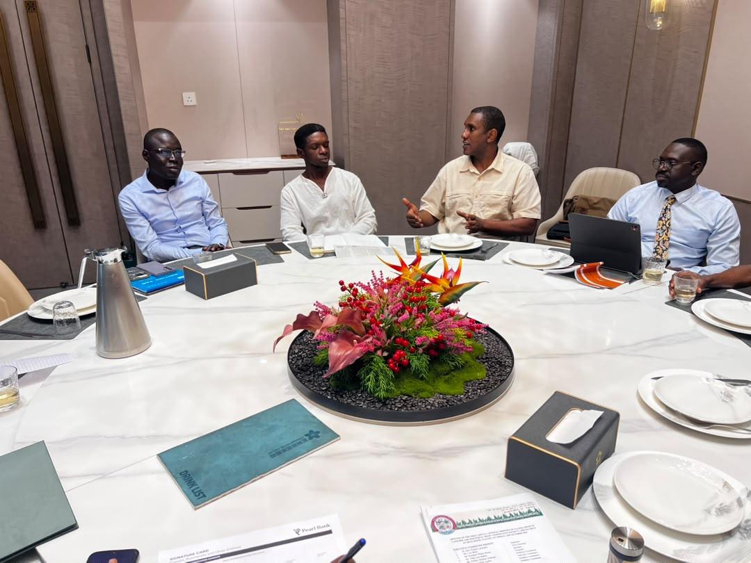 Participants in conversation around a round table